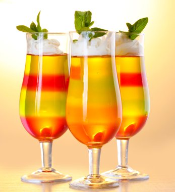 Fruit jelly in glasses on tabla in cafe clipart