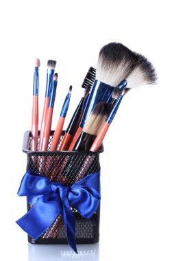 Make-up brushes in holder isolated on white