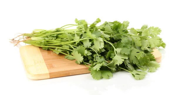 Fresh coriander or cilantro on wooden board isolated on white — Stock Photo, Image