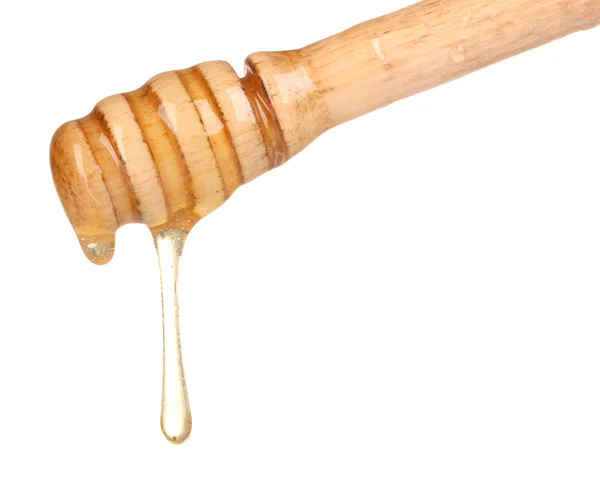 Wooden honey dipper with honey isolated on white — Stock Photo, Image