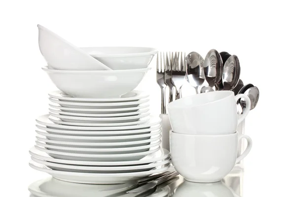 stock image Clean plates, cups and cutlery isolated on white