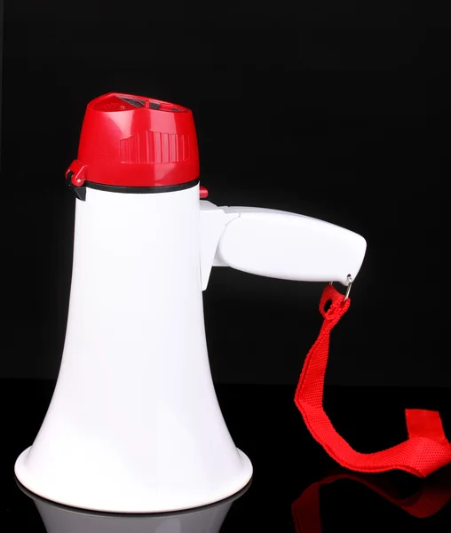 Red and white megaphone isolated on black — Stock Photo, Image