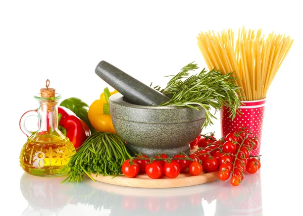 Spaghetti in cup, rosemary in mortar, jar of oil and vegetables on wooden board isolated on white — Stock Photo, Image