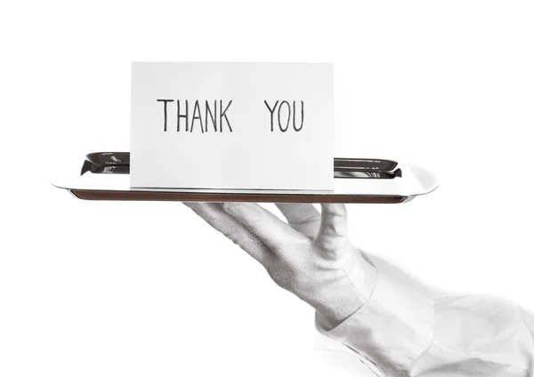 Χέρι-γάντι, κρατώντας το ασημένιο δίσκο με κάρτα λέγοντας ευχαριστώ απομονωθεί σε λευκό — Φωτογραφία Αρχείου