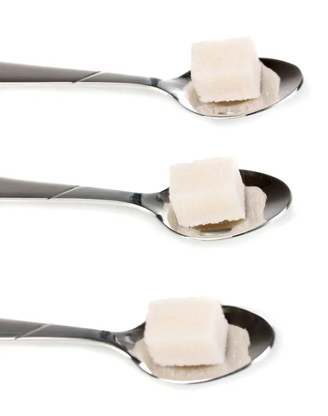 Three silver spoons with sugar isolated on white — Stock Photo, Image