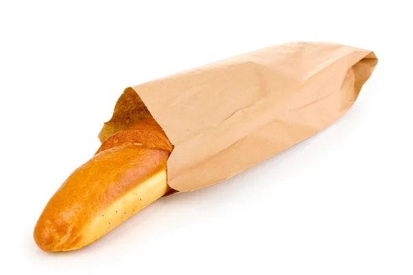 Baguete aromática em saco de papel isolado em branco — Fotografia de Stock