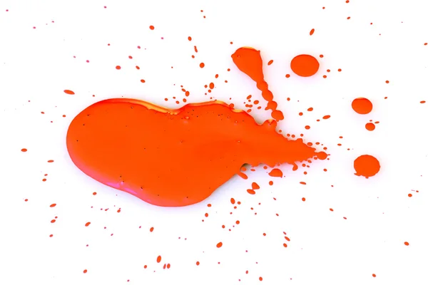 Ярко-оранжевая краска на белом фоне — стоковое фото