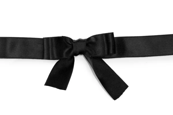 Black bow on ribbon isolated on white — Stock Photo, Image