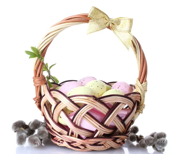 Basket with Easter eggs and pussy-willow twigs isolated on white — Stok fotoğraf
