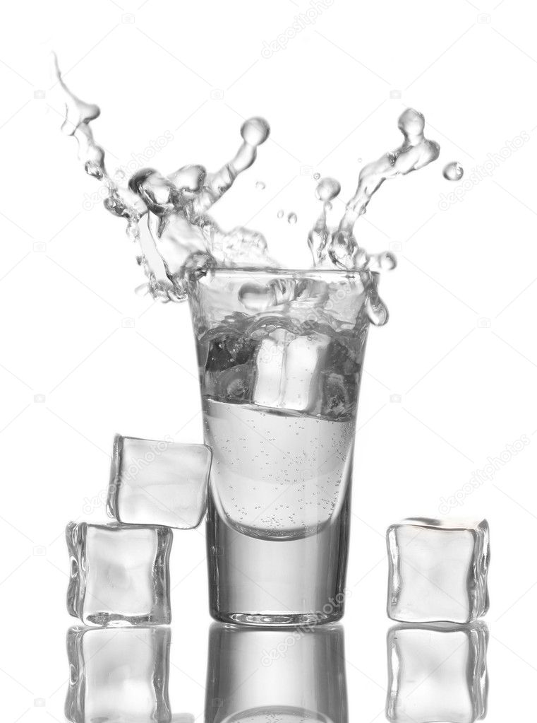 Glass vodka and ice isolated on white