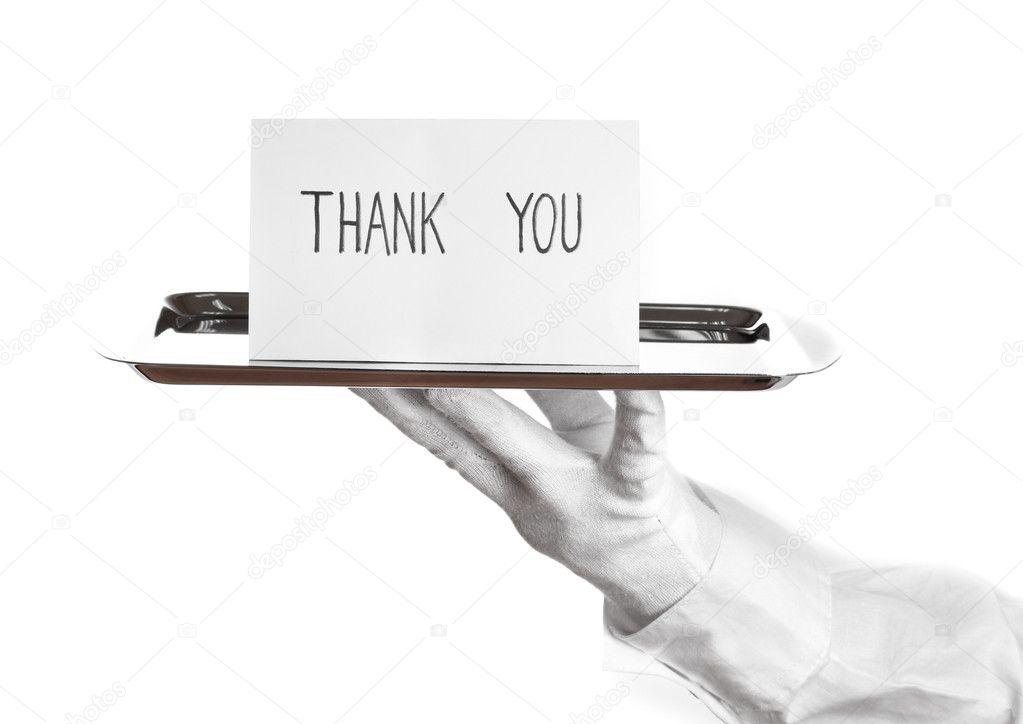 Hand in glove holding silver tray with card saying thank you isolated on white