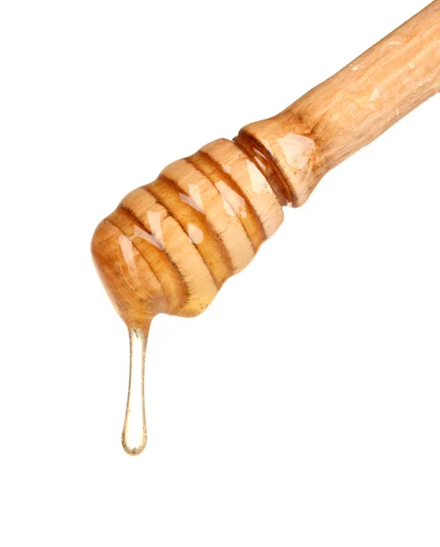 Honiglöffel aus Holz mit Honig isoliert auf weiß — Stockfoto