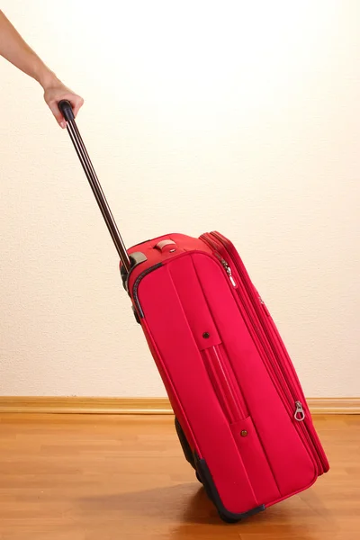 stock image Red suitcase in the room