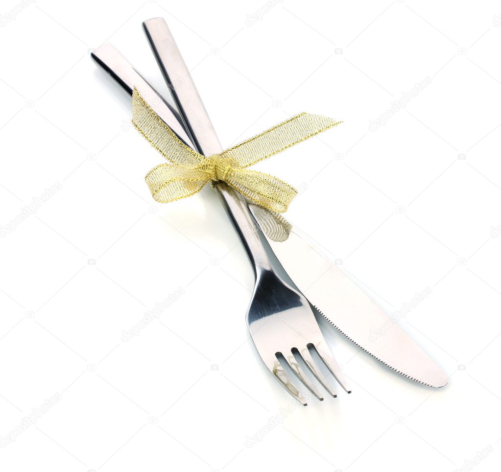 Silver fork and knife tied with ribbon isolated on white