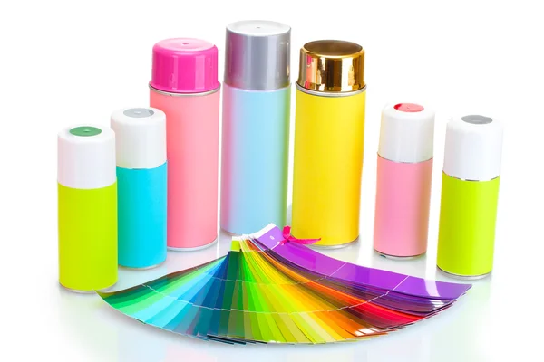 Aerosol cans and bright paper palette isolated on white — Stock Photo, Image