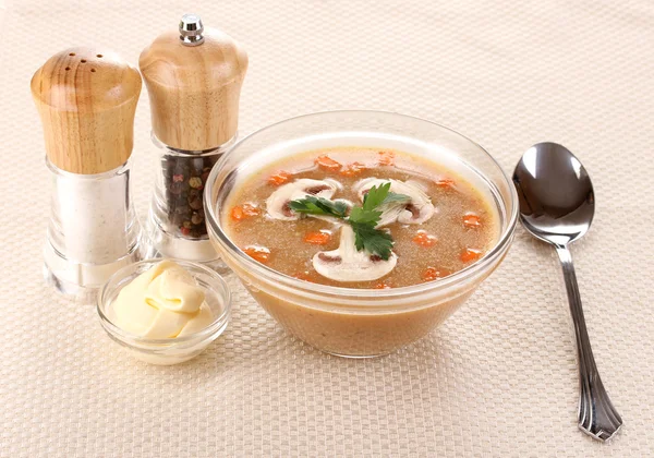 Tasty soup on beige tablecloth — Stock Photo, Image