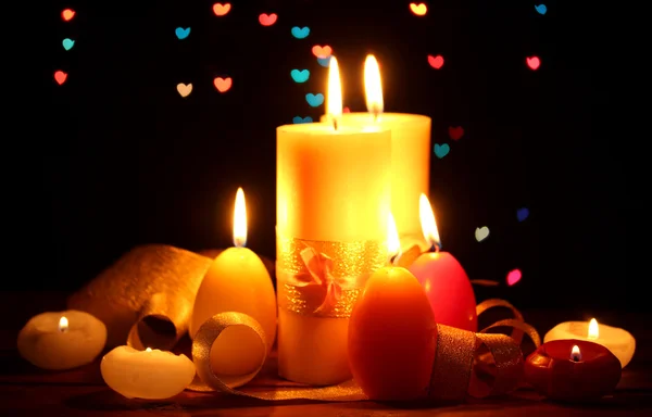 Beautiful candle and decor on wooden table on bright background — Stock Photo, Image