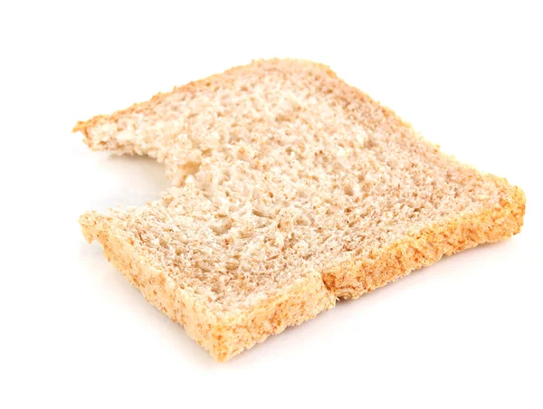 Bitten slice of wheat bread isolated on white — Stock Photo, Image