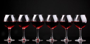 Wineglasses isolated on black clipart