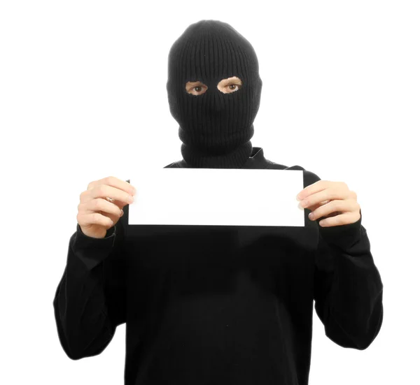 Bandit in zwart masker met lege kaart geïsoleerd op wit — Stockfoto