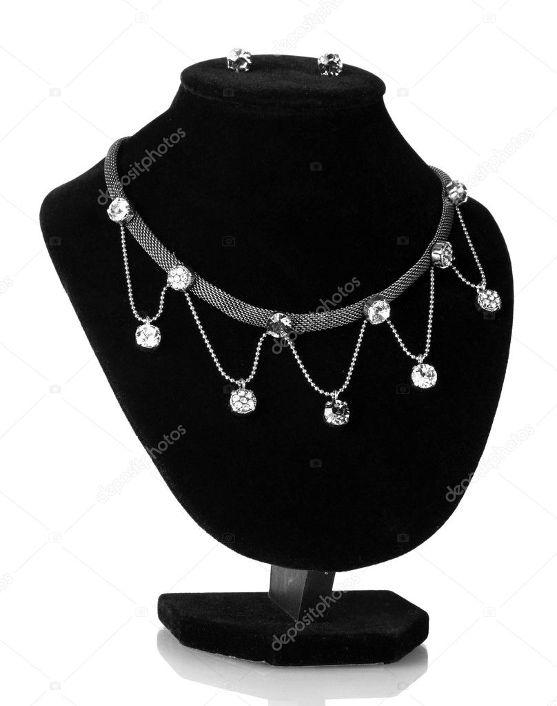 Beautiful silver necklace and earrings on mannequin isolated on white