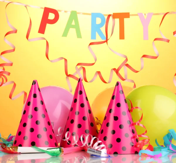 Party items on orange background — Stock Photo, Image