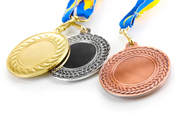 Три медали выделены на белом — стоковое фото
