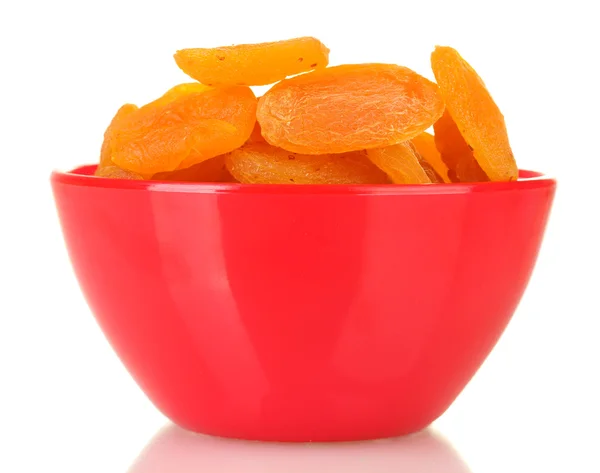 Delicious dried apricots in bright bowl isolated on white Stock Photo