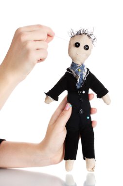 Voodoo doll boy-groom in the hands of women isolated on white clipart