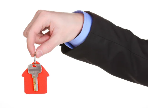 Schlüssel mit hausförmigem Charme in der Hand isoliert auf weiß — Stockfoto