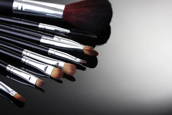 stock image Make-up brushes on grey background