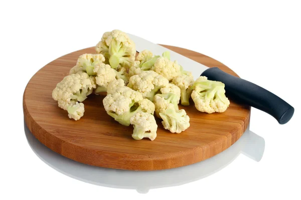 stock image Fresh cauliflower and knife on cutting board isolated on white