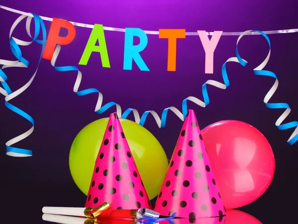 Party items on purple background — Stock Photo, Image