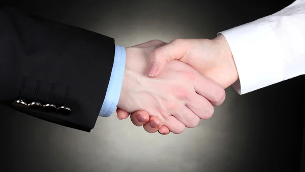 Obchodní handshake na šedém pozadí — Stock fotografie