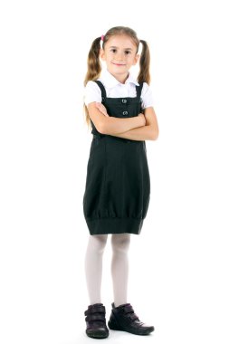 güzel küçük bir kız okul üniforması üzerinde beyaz izole