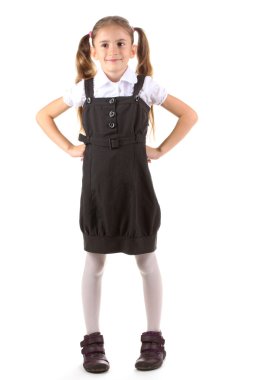 güzel küçük bir kız okul üniforması üzerinde beyaz izole