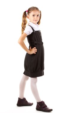 Beautiful little girl in school uniform isolated on white clipart