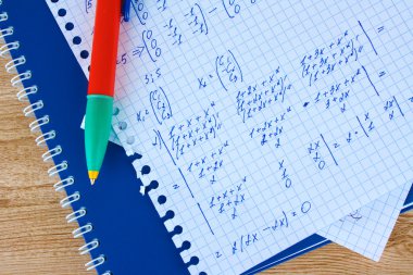 Math on copybook page closeup clipart