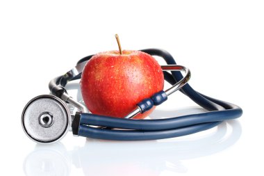sağlık stetoskop ve üzerinde beyaz izole Kırmızı elma