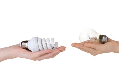 Woman's hand offering ordinary light bulb and the other woman's h clipart