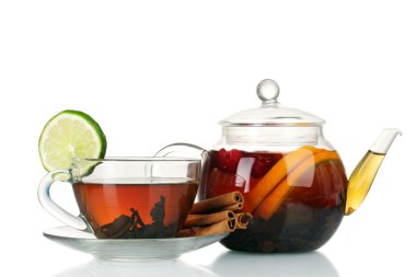 Glass teapot and cup with black tea of orange, cinnamon isolated on white clipart