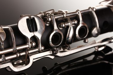 Close up detail of clarinet on gray background clipart