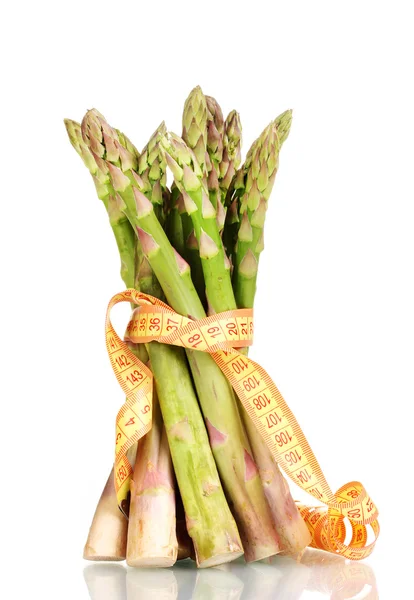 Delicious asparagus and measuring tape isolated on white — Stock Photo, Image