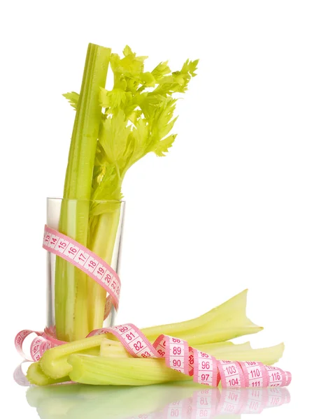 Fresh green celery in the glass and measuring tape isolated on white — Stock Photo, Image