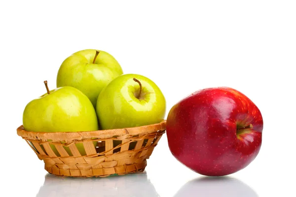 Juicy green apples in basket and red apple isolated on white — Stock Photo, Image