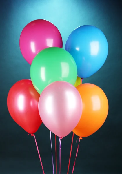 Bright balloons on blue background — Stock Photo, Image
