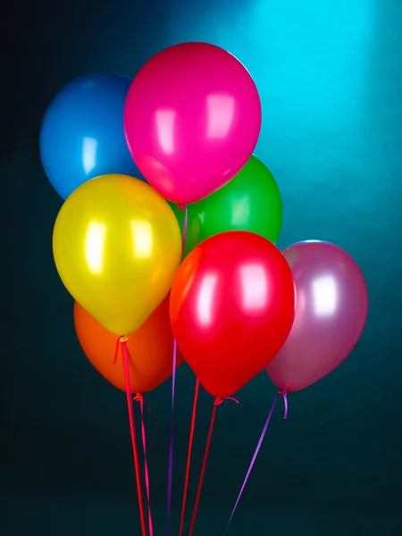Bright balloons on blue background — Stock Photo, Image