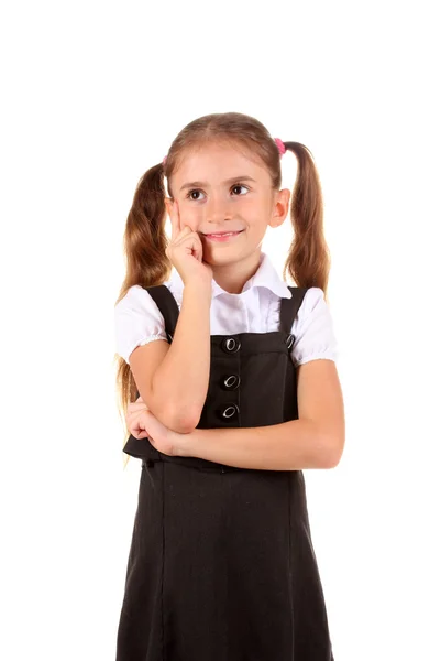 Linda menina em uniforme escolar isolado no branco — Fotografia de Stock
