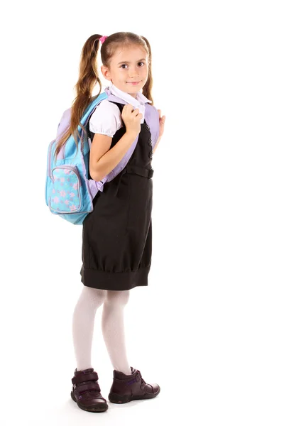 Szép kislány az iskola egységes a hátizsák portréja. elszigetelt — Stock Fotó