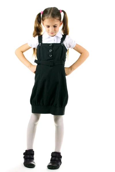 Vacker liten flicka i skoluniform isolerad på vit — Stockfoto